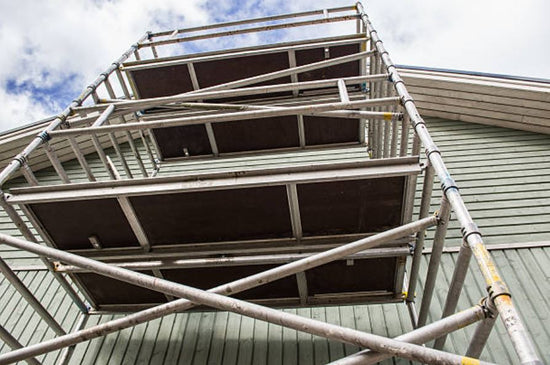 Multiple Scaffolding Platforms On A House 